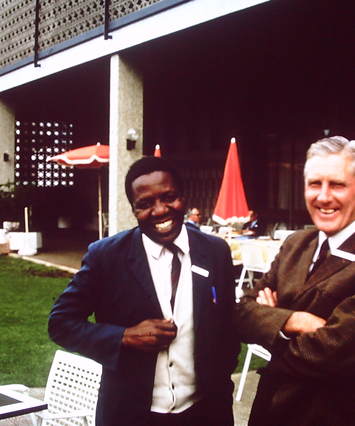 Unknown person with Alan Knight on the right at multiracial conference in Pretoria