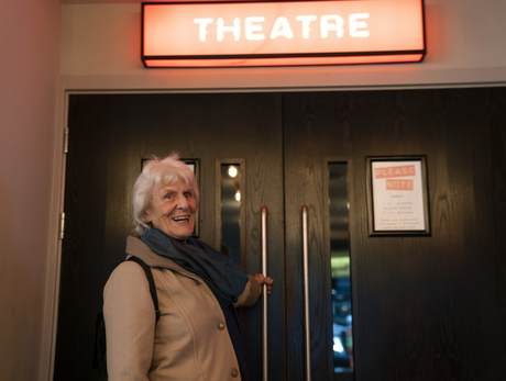 Chris Channer outside a theatre